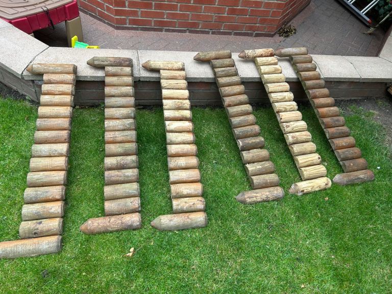 Wooden garden fence log edging 