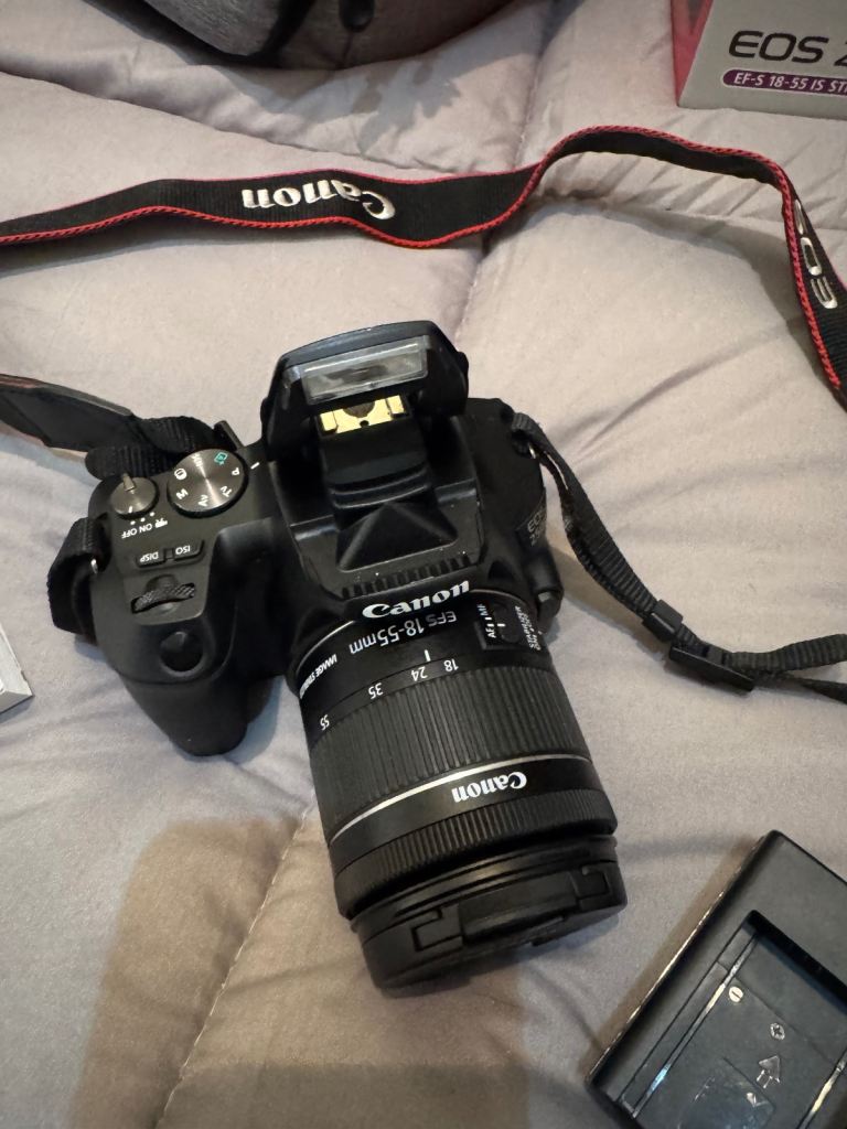 CANON CAMERA WITH LENS / charger / remote / card 1 camera back pack new & 1 camera carry case