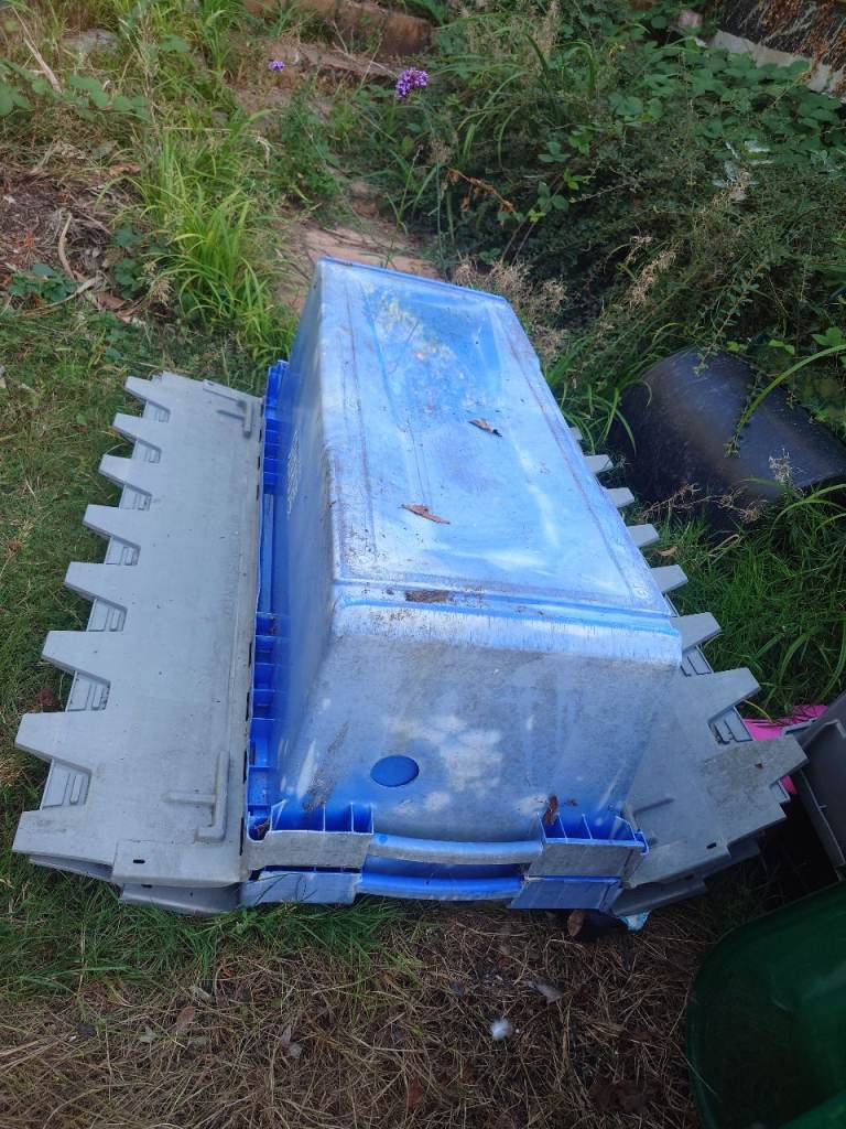 Two large plastic crates.