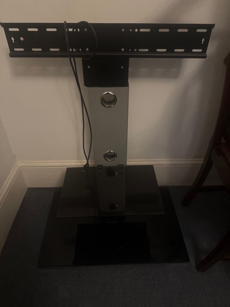 Silver and black tv stand 