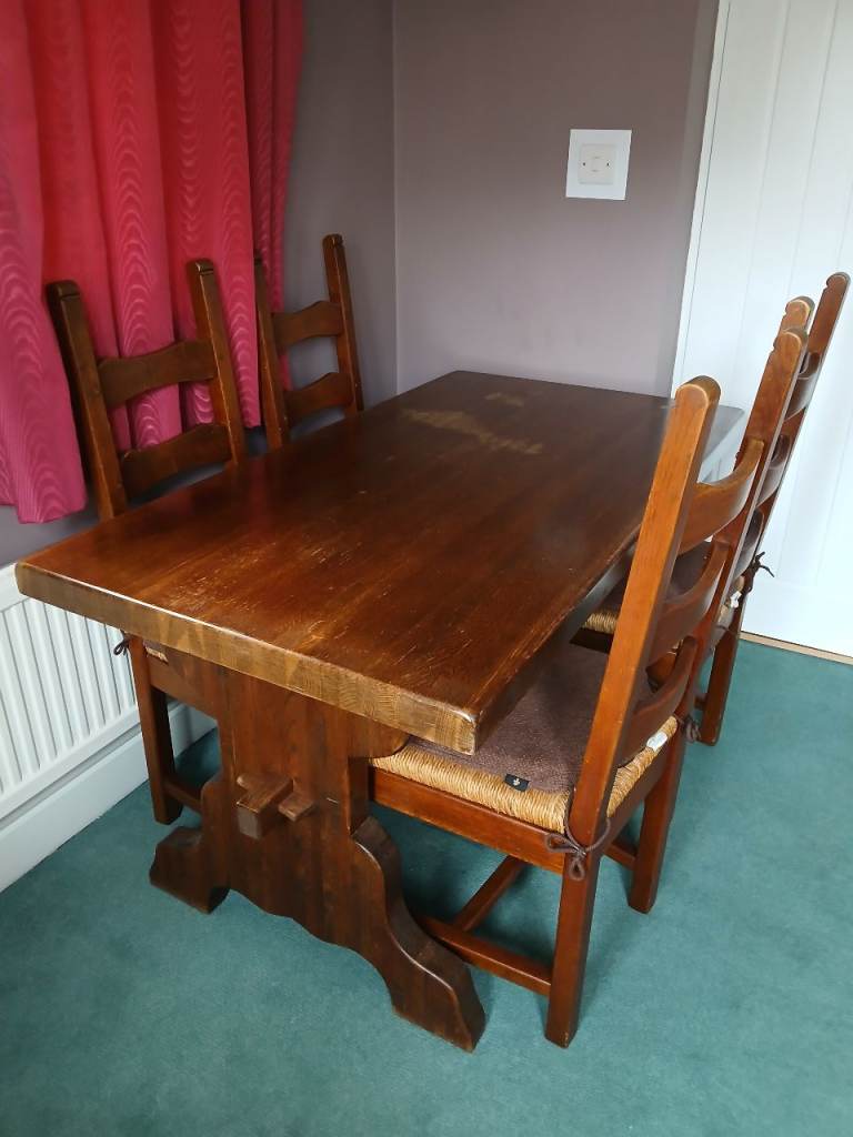 Solid oak dining table and 4 chairs 