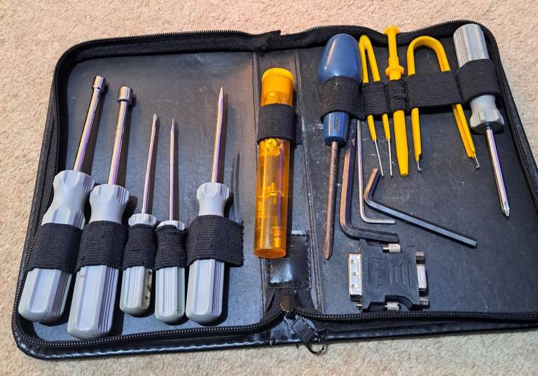 Zipped Vinyl case of computer tools.