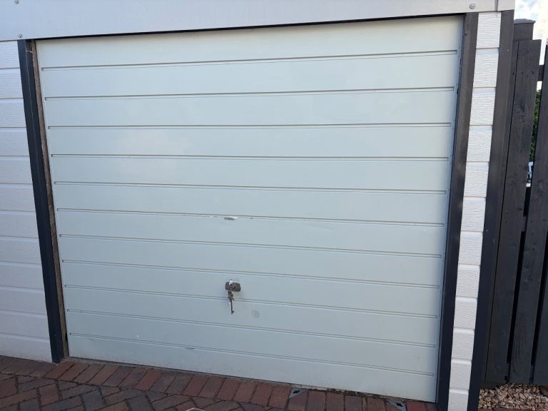 Light grey up and over garage door 