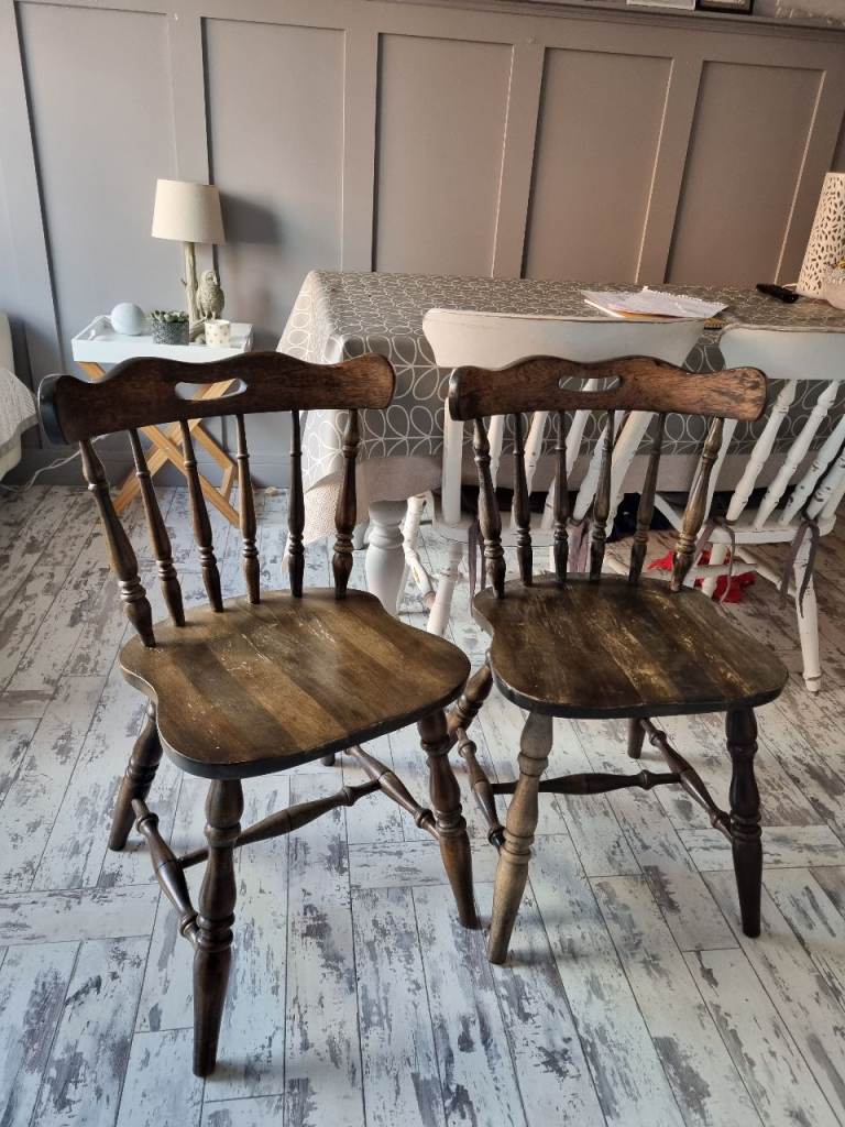 Two wooden dining chairs