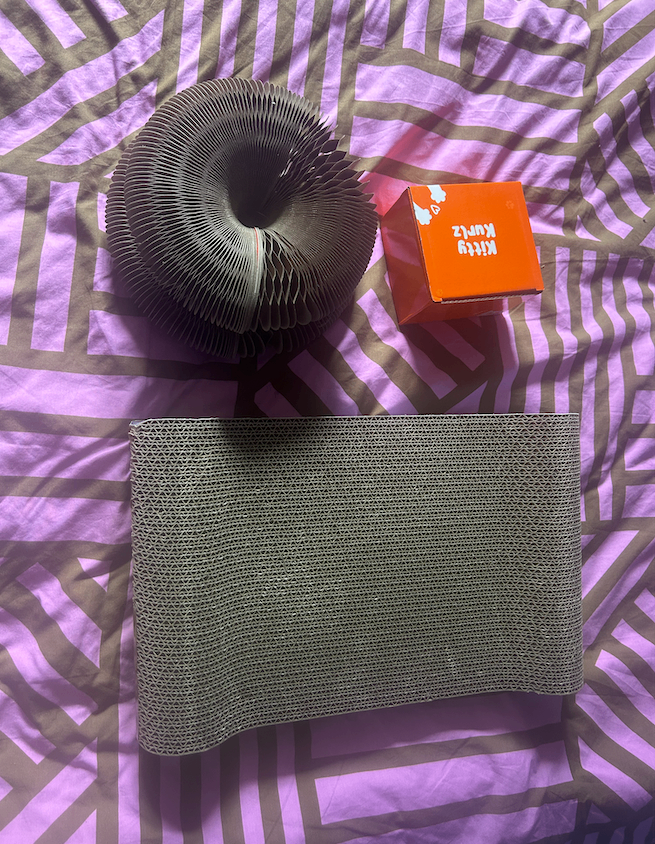 Cardboard cat toy bundle, one scratching pad and two Kitty Kurlz, one in box