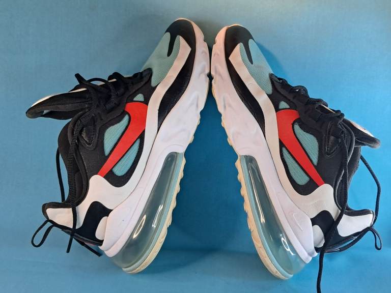 Pair of women's Nike Air Max 270 React sneakers, Bleached Aqua" colorway