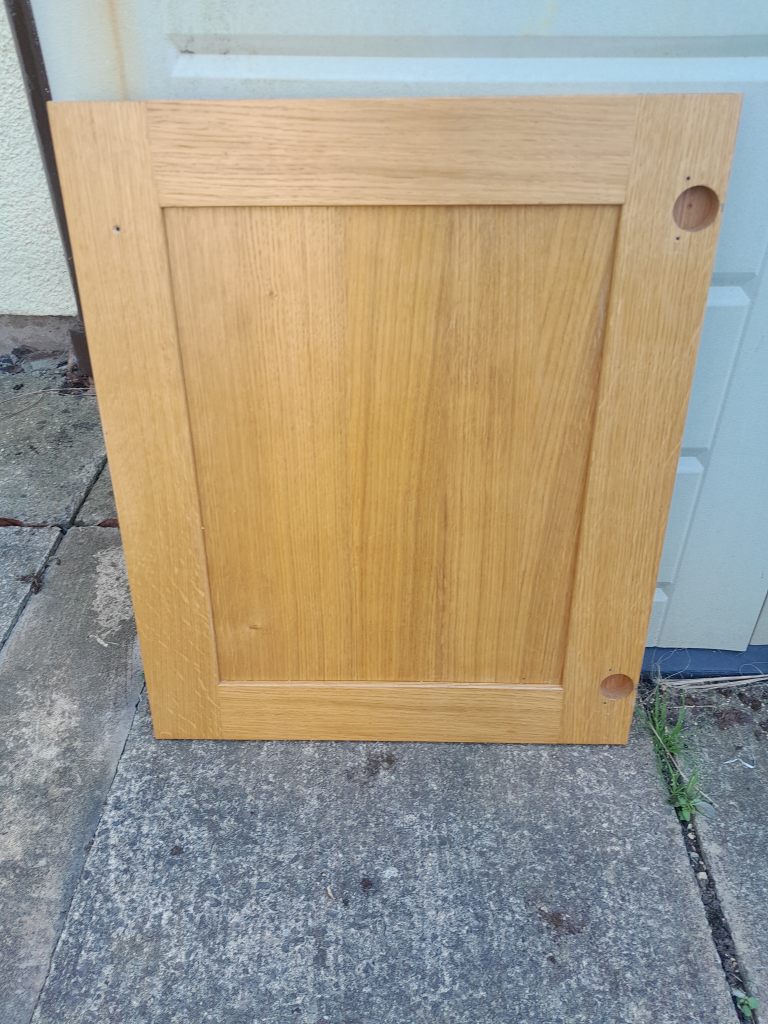 Oak kitchen cabinet door.