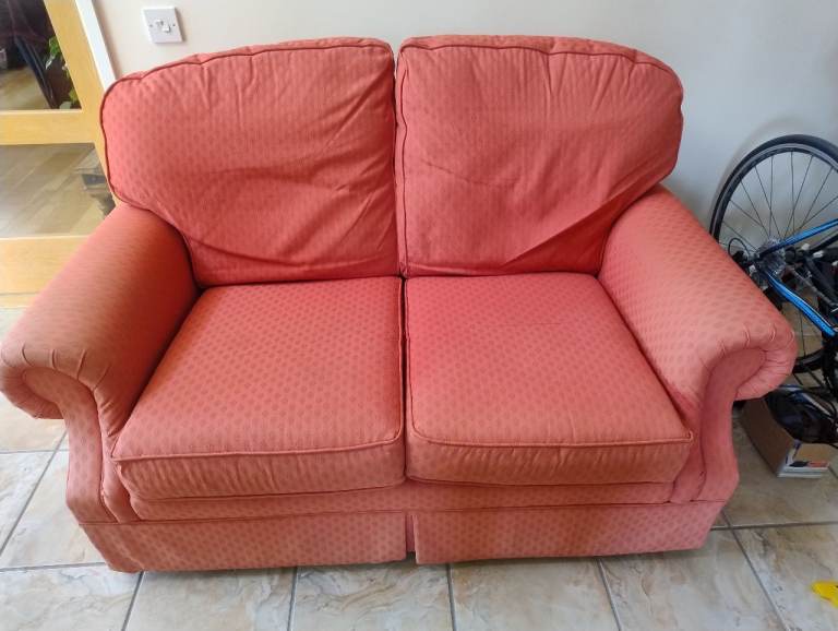 Two seater settee Rust/ Orange ( has grey velour full covers)