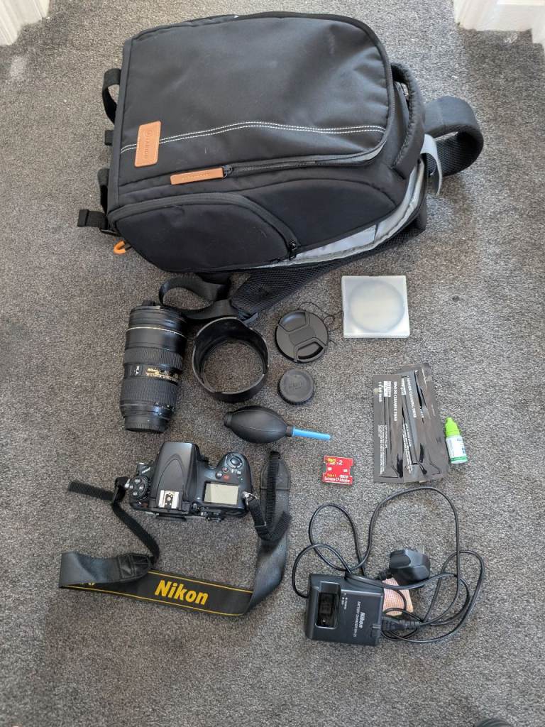Nikon DSLR Camera Kit with Lens, Bag, and Cleaning Accessories