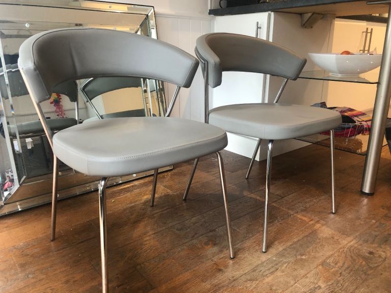 Two Italian leather Calligaris dining chairs