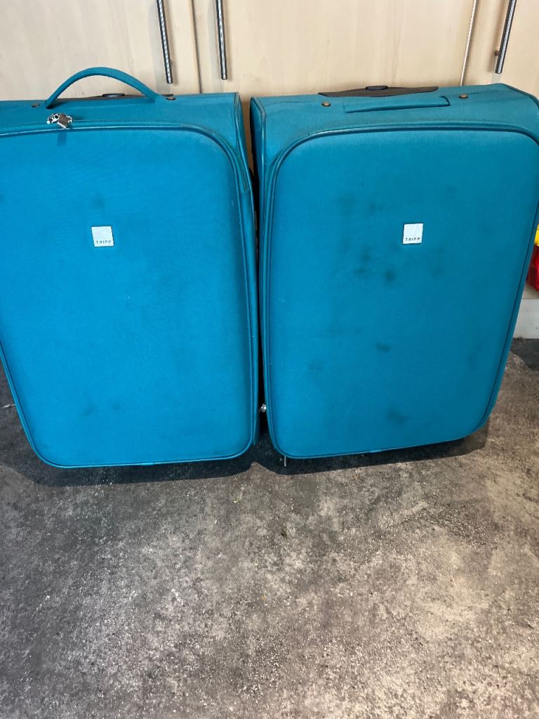 2 large Tripp suitcases