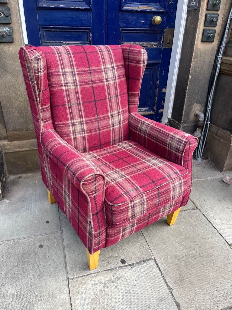 Lovely red plaid wingback armchair in good condition.
