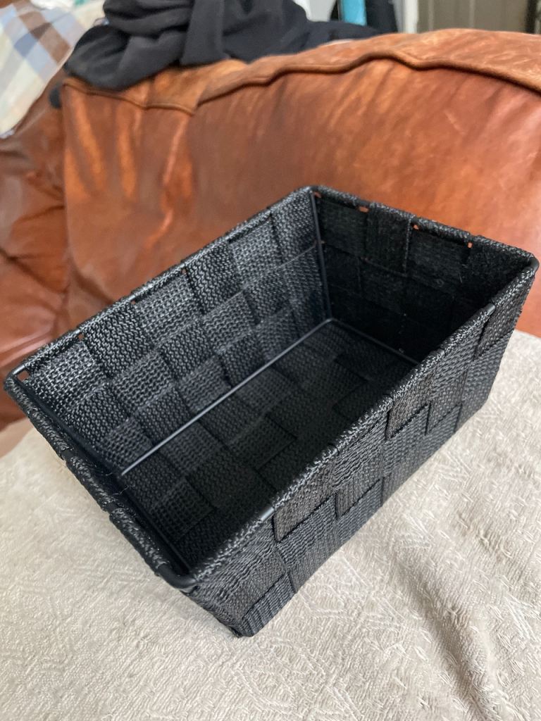17 black metal and fabric small baskets 