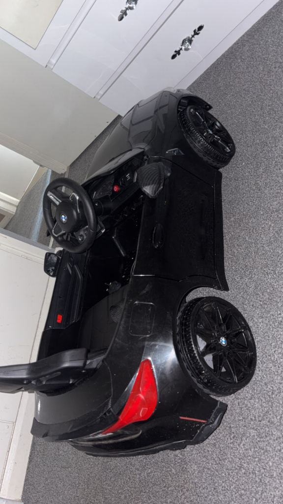 Black bmw electric car good condition got the remote for u to control the car :)