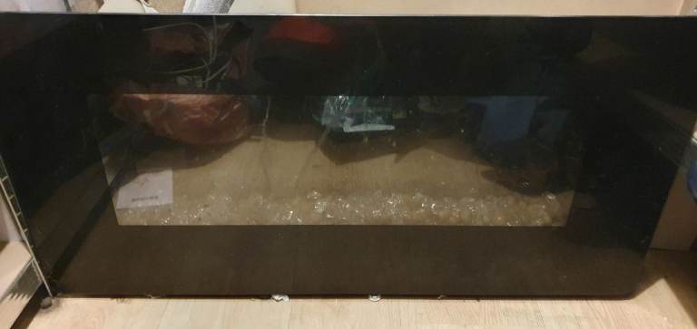 Electric fire with fake fire lit mantel back light 