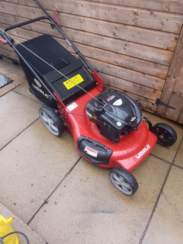 23" world self propelled petrol lawnmower 