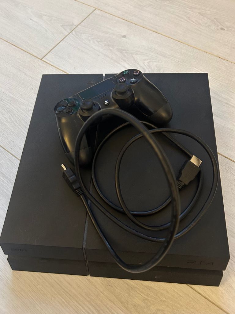 PlayStation 4 (PS4) 500gb with Controller and 8 Games – Good Condition