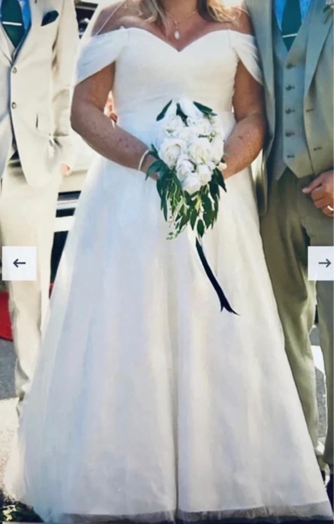 Ivory wedding dress UK 22 but altered to fit a size 18