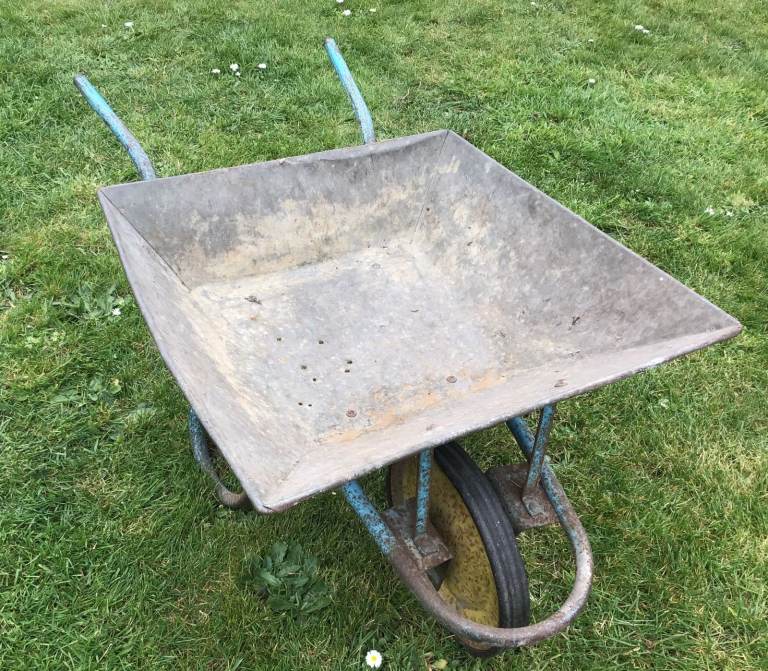 Lightweight Garden Wheelbarrow with Galvanized Tray Perfect for Displays.
