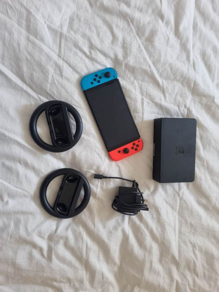 Nintendo Switch OLED console with Dock, Charger and Steering Wheels