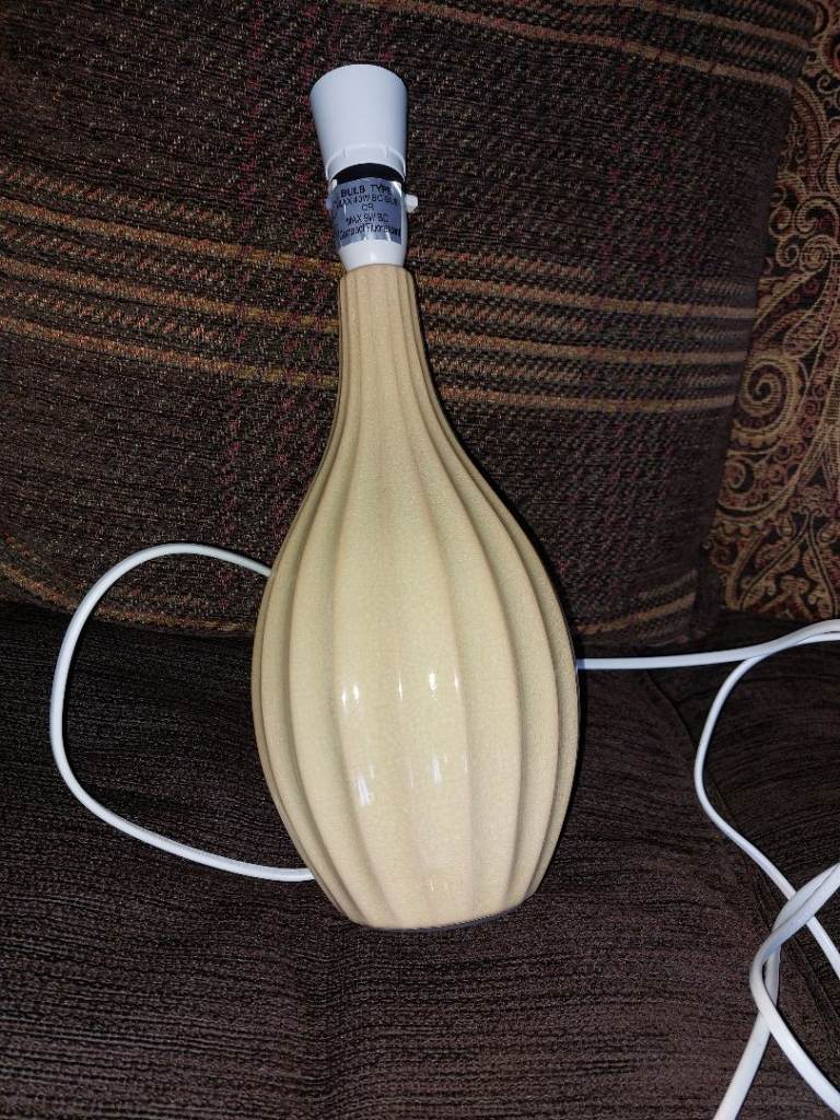 Apricot coloured pottery lamp base, with vertical ridged design £3