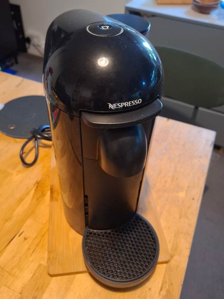 Nespresso VertuoPlus Coffee Pod Machine and pod stand