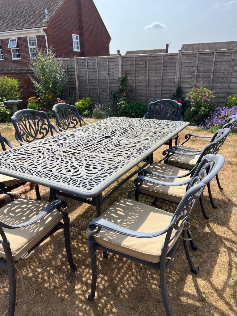 Large Cast Iron Garden Table with 8 Chairs and Cushions