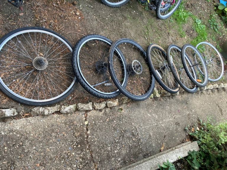 7 X Bike wheels some with brake discs   