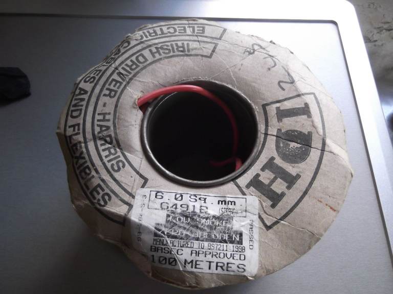 65 metres unused 6mm single core red cable (old colours) to BS7211