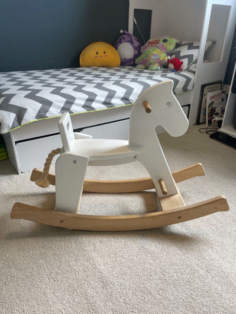 Wooden rocking horse.