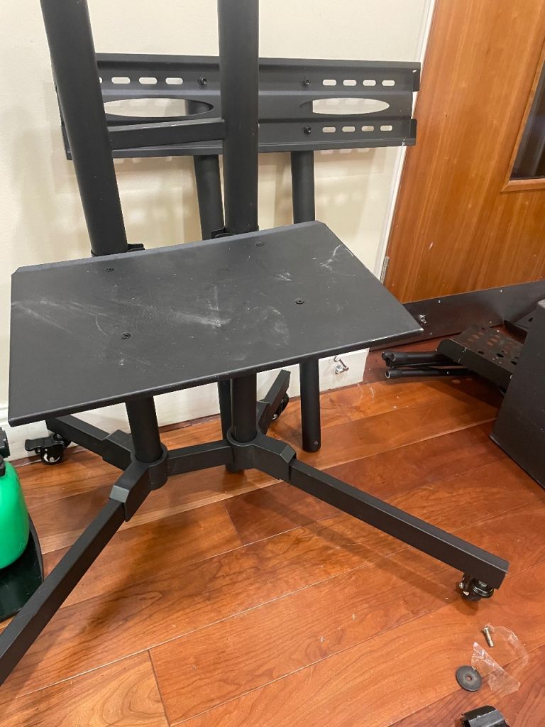 Black Metal TV Stand on Wheels – Good Condition