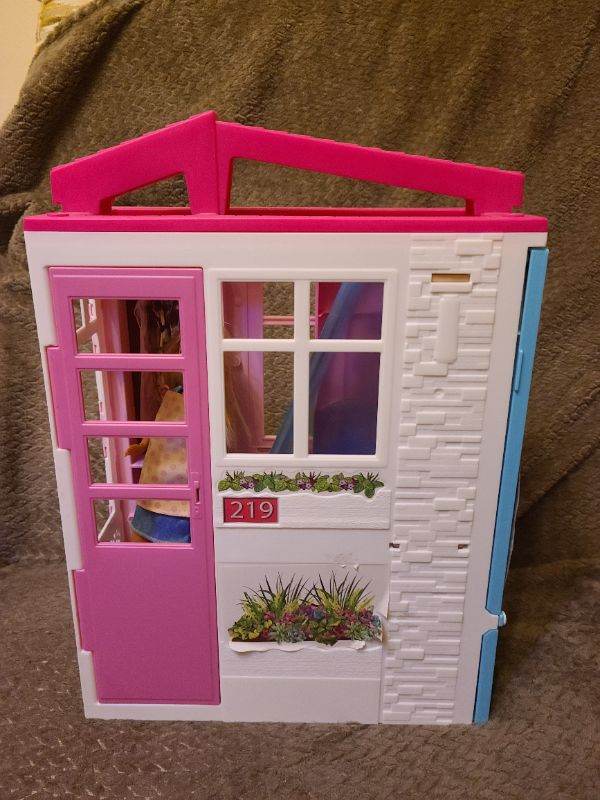 Barbie fold away house with a barbie