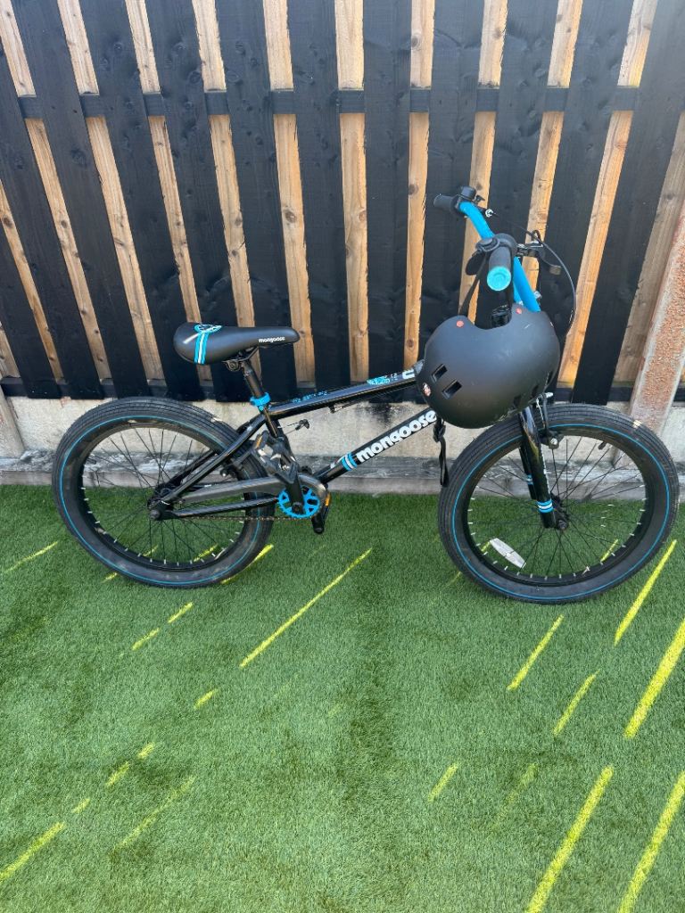 Mongoose kids bmx with mongoose helmet.