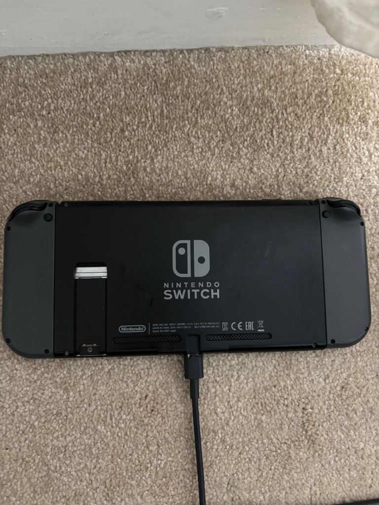 Nintendo Switch Console with Mario Deluxe Game & Mario Day Carry Case