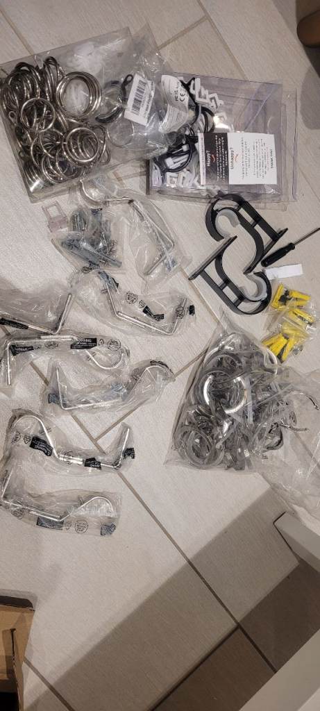Assortment of curtain rings, brackets, screws etc.