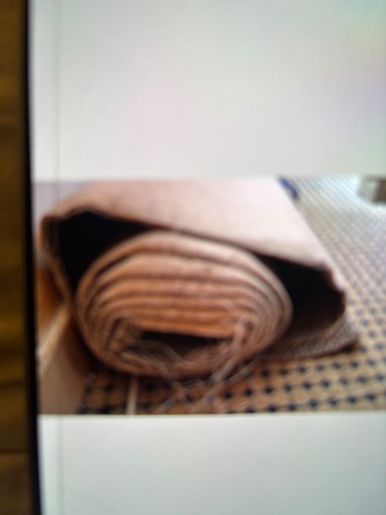Rolled up beige carpet 
