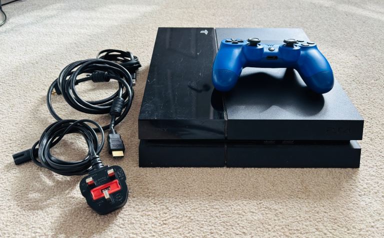Sony PlayStation 4 with Blue Controller and Games – Good Condition