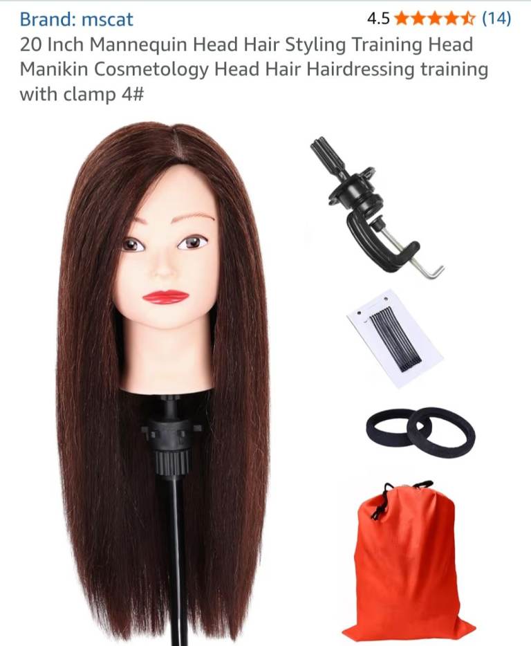 Dark hair dressing practicing head, mannequin head. Trainee hairdressers head. 