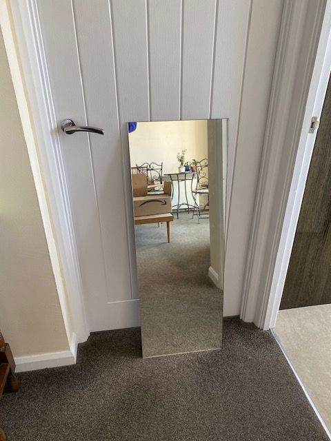 Plain unframed full length mirror