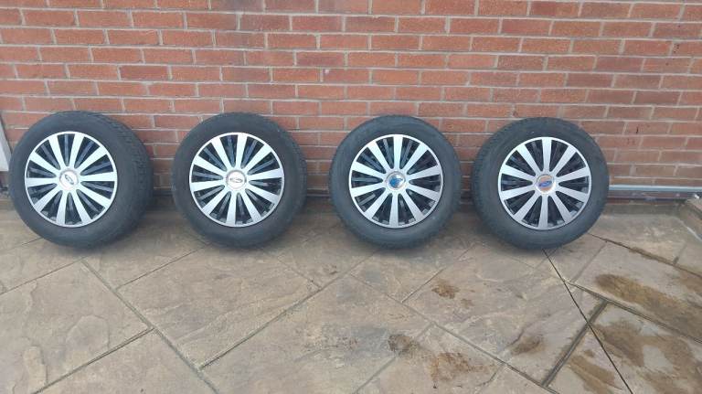 4 stud Ford steel wheels with 195 60 15 tyres 