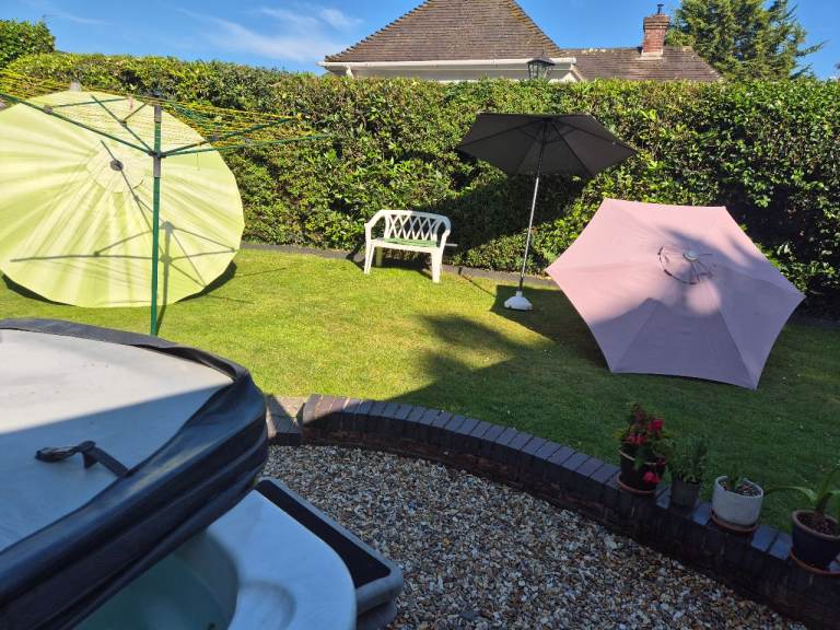 3 Garden parasols and one base.