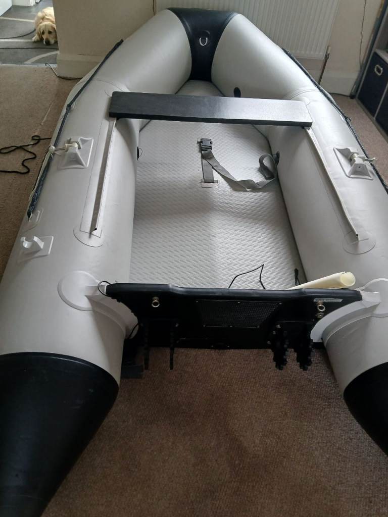 Inflatable Rib boat, engine and launch trailer 
