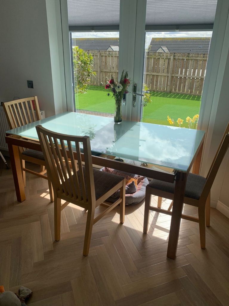 Glass top dining table.