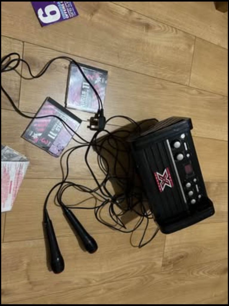 X factor  karaoke machine  with mics and cd and songs - led light effect - lyrics on tv