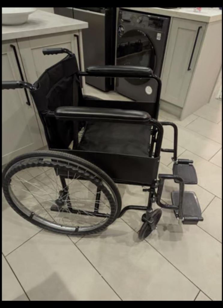 Self propelled black wheelchair adult 