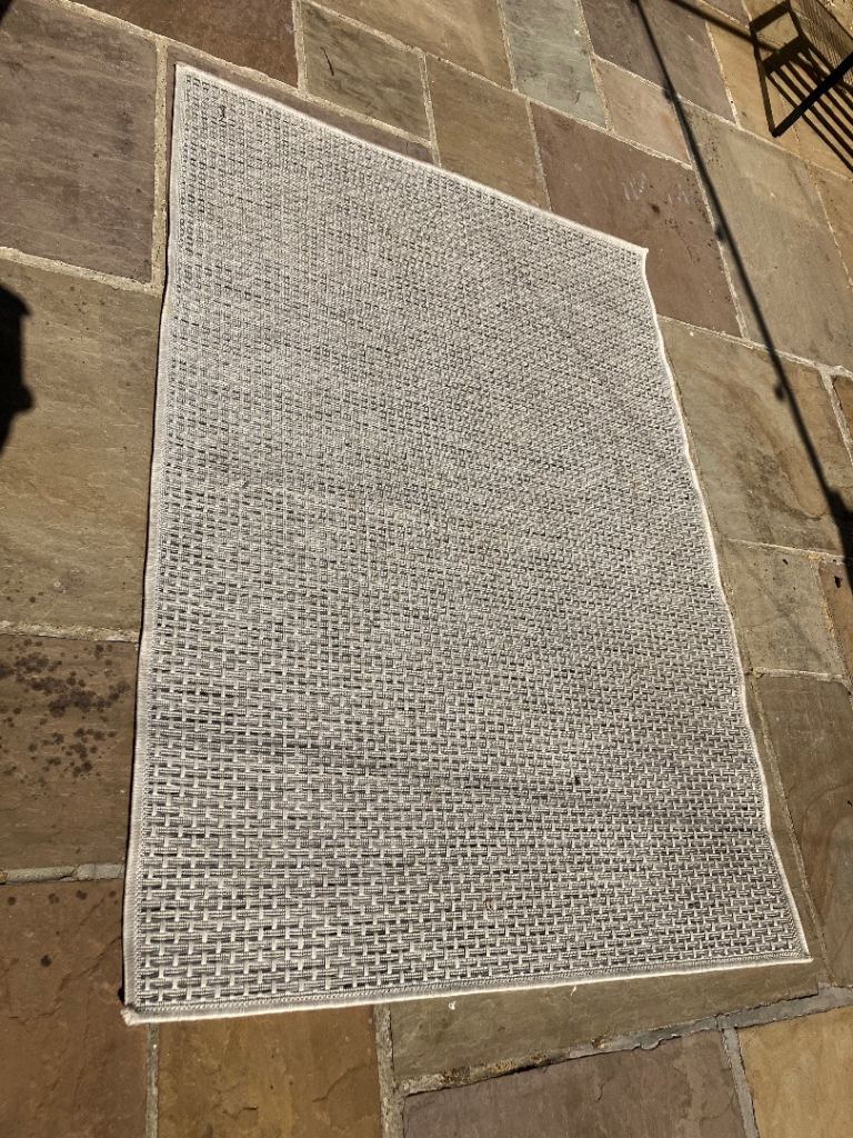 Washable outdoor rug, or can be used inside needs a ckean other wise om good condition