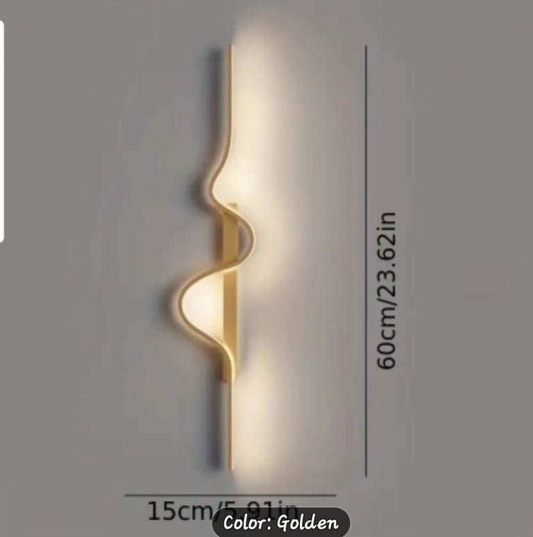 Gold statement wall light. New in box 
