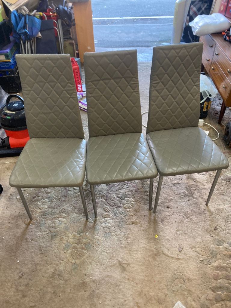Set of three grey quilted chairs