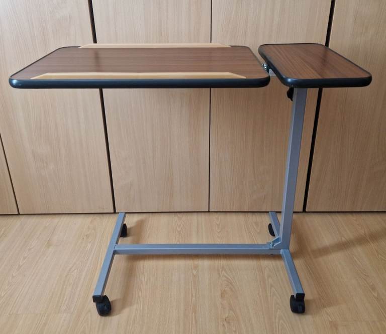 Tilting overbed table height adjustable