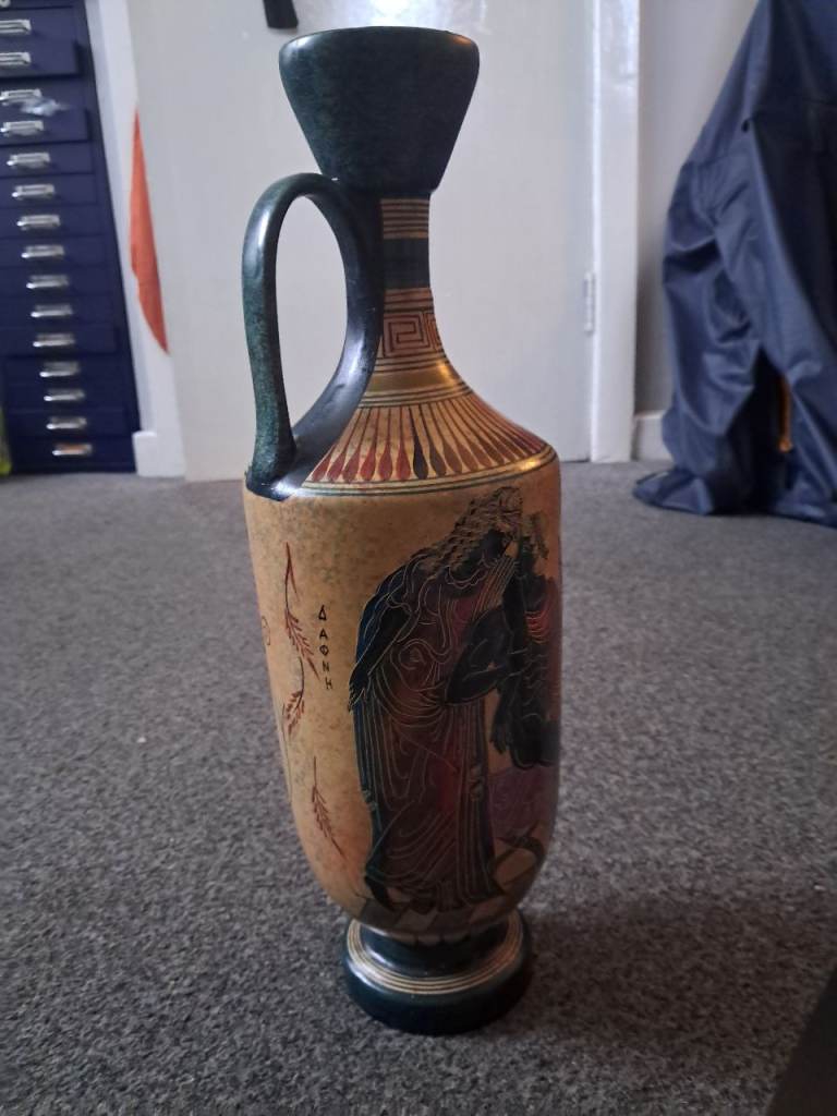 This is a lekythos, an ancient Greek-style oil flask handmade and hand-painted in Greece.